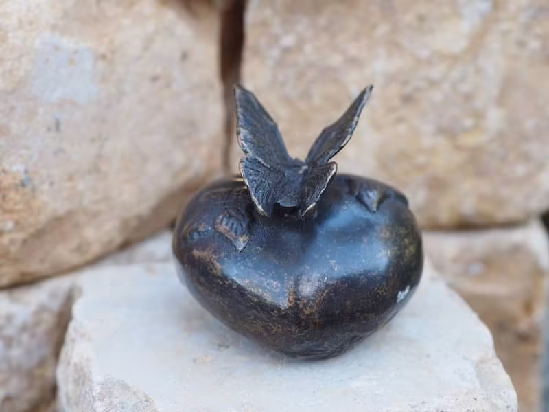 small bronze heart urn with butterflies
