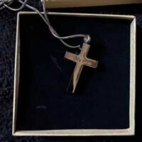 silver cross necklace that holds ashes