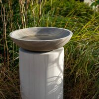 taupe birdbath with cream stone column